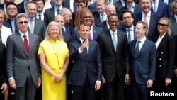 French President Macron poses for a family picture with Rwanda's President Kagame, Facebook's CEO Mark Zuckerberg and IMB's CEO Virginia Rometty at the Elysee Palace in Paris, May 23, 2018.