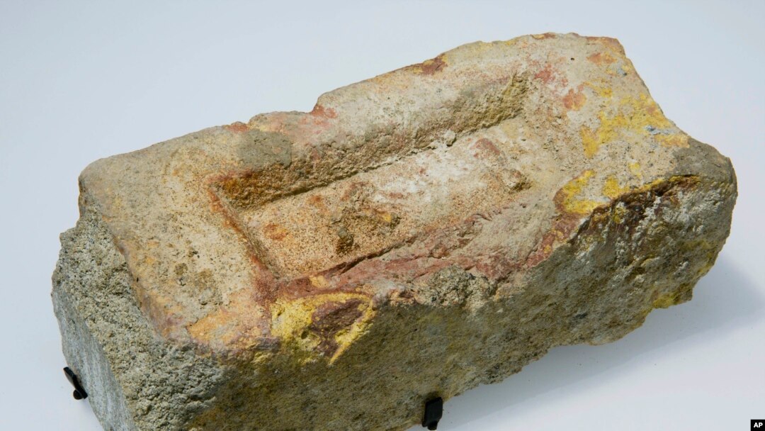 In this Sept. 5, 2014, photo provided by the National September 11 Memorial & Museum, a brick from the compound in Abbottabad, Pakistan, where Osama bin Laden was captured and killed, is shown at the museum in New York.
