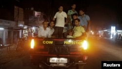 Cow vigilantes prepare to set up a road block near Chandigarh, India, July 6, 2017. In the nearby state of Rajasthan, a group of villagers attacked and killed a Muslim man transporting two cows.