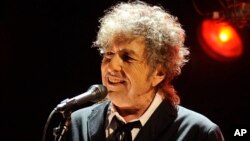 FILE - Bob Dylan performs in Los Angeles, Jan. 12, 2012. 