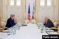 U.S. Secretary of State John Kerry sits across from Iranian Foreign Minister Javad Zarif on June 30, 2015, in Vienna, Austria, before a one-on-one meeting amid negotiations about the future of Iran's nuclear program. (Photo: State Department)