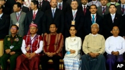 First row, left to right; Myanmar's Army Commander Senior Gen. Min Aung Hlaing, Myanmar Upper House speaker of Mann Win Khaing Than, Vice President Henry Van Hti Yu, Foreign Minister Aung San Suu Kyi, President Htin Kyaw, and Vice President Mint Swe, sit for a photo session following the Union Peace Conference-21st Century Panglong at the Myanmar International Convention Centre, Aug. 31, 2016, in Naypyitaw, Myanmar.
