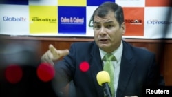 Ecuador's President Rafael Correa gestures during an interview in Loja, Ecuador, August 17, 2012.