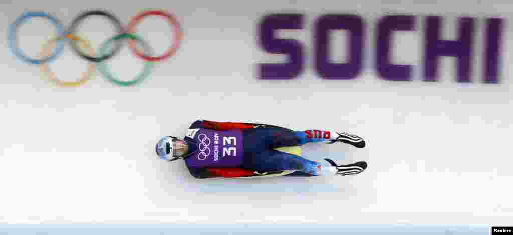 Russia&#39;s Semen Pavlichenko speeds down the track during a men luge training at the Sanki sliding center in Rosa Khutor, Feb. 6, 2014. 