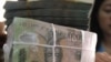 Vietnam Devalues Currency as Inflation Bites
