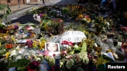 Flowers are pictured on the street where Heather Heyer was killed when a suspected white nationalist crashed his car into anti-racist demonstrators in Charlottesville, Virginia, U.S., Aug. 16, 2017. 