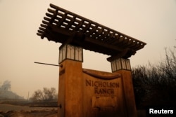 A charred entrance to the Nicholson Vineyards and Winery damaged by the Partrick Fire is seen in Sonoma, California, Oct. 11, 2017.