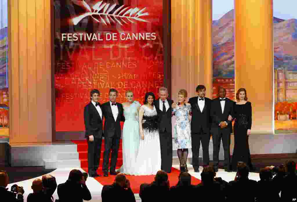 From left members of the jury Alexander Payne, Ewan McGregor, Diane Kruger, Hiam Abbass, Jean-Paul Gaultier, Andrea Arnold, Nanni Moretti, Raoul Peck, and Emmanuelle Devos at the opening ceremony at the 65th international film festival, in Cannes, France,