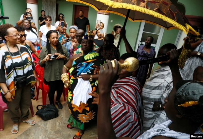 Chief of Nkwantakese, Nana Boakye Yam Ababio II, performs a traditional dance in front of members of a heritage tour group visiting his village, in Ashanti region, Ghana August 10, 2019. Picture taken August 10, 2019. REUTERS/Francis Kokorok