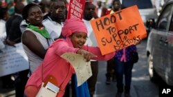 Doctors and other medical staff protest the detention of their union leaders, outside an appeal court in Nairobi, Kenya, Feb. 15, 2017.