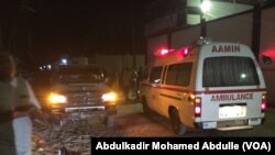 FILE - An Aamin Ambulance waits as Somali security forces end an al-Shabab siege of two Mogadishu restaurants, June 2017.