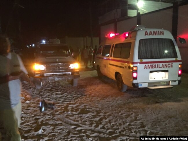 One of the Aamin ambulances waits outside Pizza House as Somali security forces end an al-Shabab siege of two Mogadishu restaurants early Thursday morning.