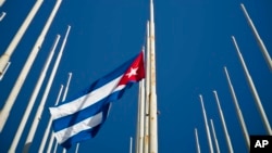 A Cuban flag flies at half-mast after the death of Fidel Castro, at the anti-imperialist tribune in Havana, Cuba, Nov. 26, 2016. Castro, who led a rebel army to improbable victory in Cuba, embraced Soviet-style communism and defied the power of U.S. presidents during his half century rule, died at age 90 late Friday.