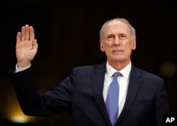 Director of National Intelligence-designate Dan Coats is sworn-in on Capitol Hill in Washington, Feb. 28, 2017, at his confirmation hearing before the Senate Intelligence Committee. in Washington.
