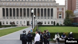 Law enforcement gather at Columbia University campus in response to a bomb threat in New York, New York, Nov. 7, 2021. 