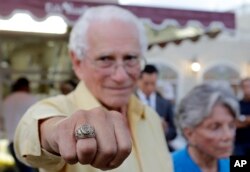 Cuban-American and veteran of Bay of Pigs Armando Gutierrez, proudly shows his Brigade ring, Jan. 12, 2017, in the Little Havana area in Miami.