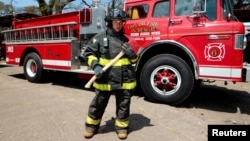 Yolaina Chavez Talavera, 31, a firefighter, poses for a photograph in front of a truck at a fire station in Managua, Nicaragua, Feb. 22, 2017. "In my early days as a female firefighter, men, my teammates, thought that I would not last long in the organization due to the hard training," she said. "However, in practice I showed them that I am able to take on tasks at the same level as men. I think women must fight to break through in all areas, in the midst of the machismo that still persists in Nicaragua and in Hispanic countries."
