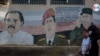 ARCHIVO - Un mural con la imagen de Daniel Ortega, Hugo Chávez y Fidel Castro en Managua. [Foto: VOA / Houston Castillo]