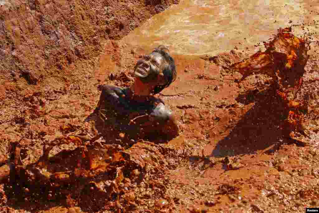 A man competes in the Tough Run Challenge charity event as part of Tour de Farm in Nakhon Ratchasima, northeastern province of Thailand.