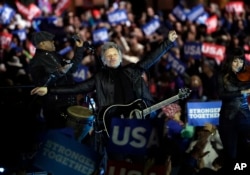 Jon Bon Jovi acknowledges applause after performing during a Hillary Clinton campaign event at Independence Mall in Philadelphia, Nov. 7, 2016.