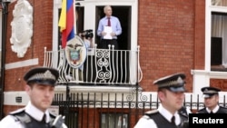 WikiLeaks founder Julian Assange steps onto the balcony before speaking to the media outside the Ecuador embassy in west London, August 19, 2012.