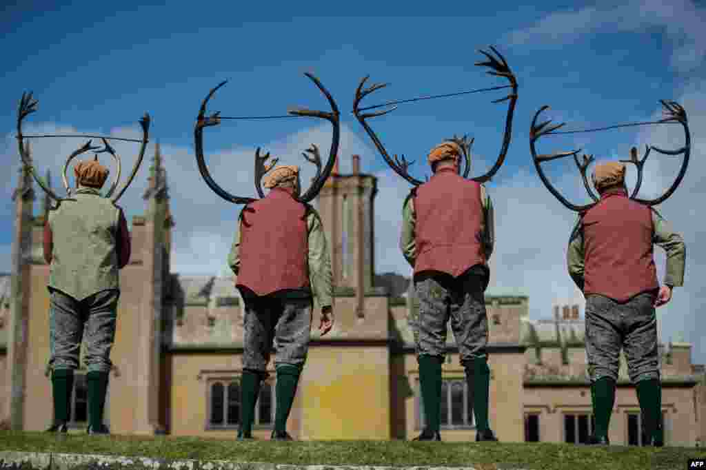 Dancers perform the &#39;Abbots Bromley Horn Dance&#39; in the grounds of Blithfield Hall, near the village of Abbots Bromley, central England.