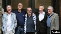 Members of British comedy troupe Monty Python, from left, Eric Idle, John Cleese, Terry Gilliam, Michael Palin and Terry Jones pose for a photograph during a media event in central London, June 30, 2014. 