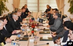 U.S. Defense Secretary Jim Mattis (3rd-L) meets with Pakistani Prime Minister Shahid Khaqan Abbasi (4th-R) in Islamabad, Pakistan, Dec. 4, 2017.