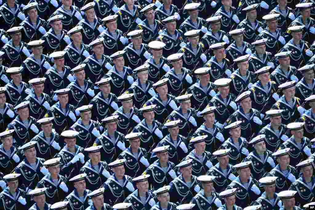 Russian sailors march toward Red Square during the Victory Day military parade marking the 75th anniversary of the Nazi defeat in Moscow, Russia.