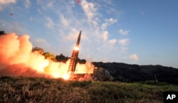 In this photo provided by South Korea Defense Ministry, South Korea's Hyunmoo II ballistic missile is fired during an exercise at an undisclosed location in South Korea, Monday, Sept. 4, 2017.