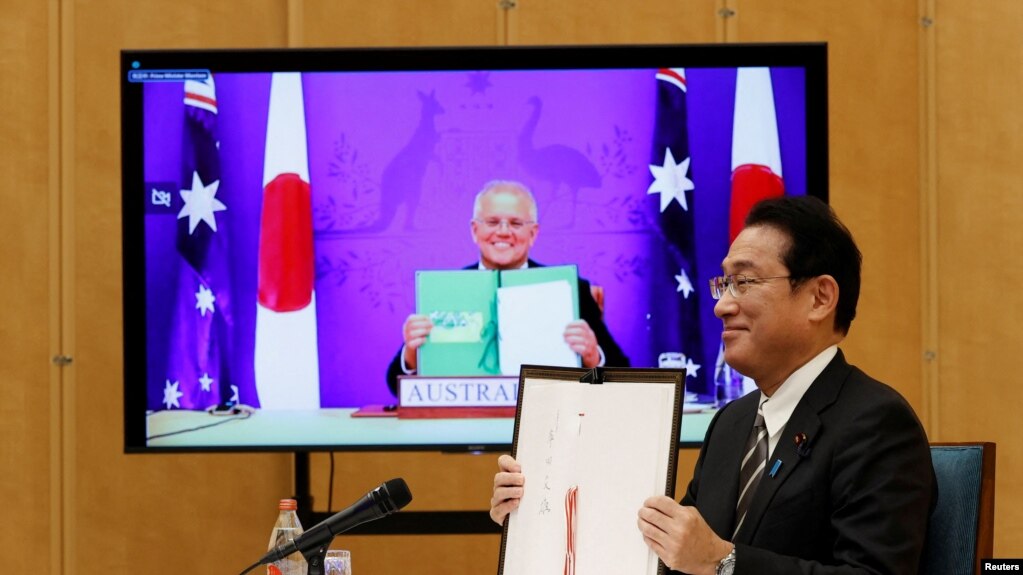 澳大利亚总理莫里森和日本首相岸田文雄2022年1月6日签署澳日防务互惠准入协定(RAA)（路透社）