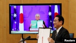 澳大利亞總理莫里森和日本首相岸田文雄2022年1月6日簽署澳日防務互惠准入協定(RAA)（路透社）