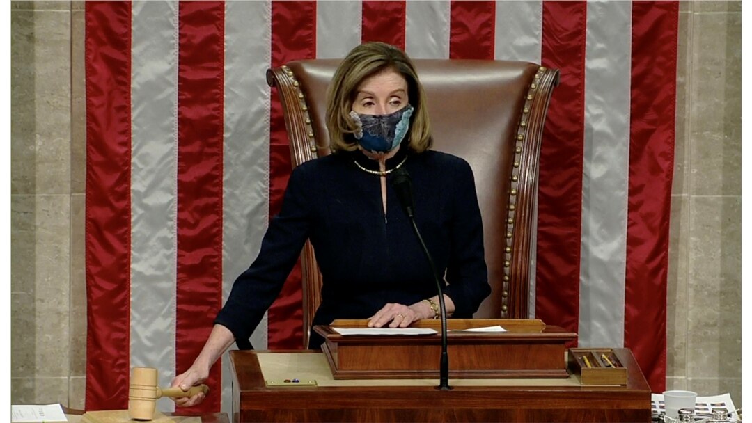 U.S. Speaker of the House Nancy Pelosi wields the gavel as House votes to impeach President Trump