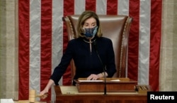 U.S. Speaker of the House Nancy Pelosi wields the gavel as House votes to impeach President Trump