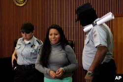 Teodora Vasquez, found guilty of what the court said was an illegal abortion via induced miscarriage, arrives in a courtroom to appeal her 30-year prison sentence, in San Salvador, El Salvador, Dec. 13, 2017.