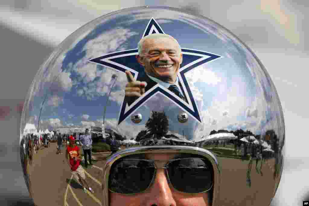 Dallas Cowboys fan Gregg Wilson arrives for the Pro Football Hall of Fame inductions, including that of Cowboys owner Jerry Jones, whose photo is on the helmet, at the Pro Football Hall of Fame in Canton, Ohio, Aug. 5, 2017.
