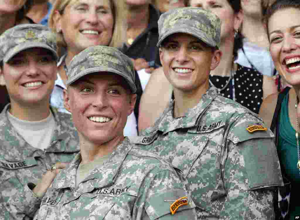 U.S. Army First Lt. Shaye Haver, center, and Capt. Kristen Griest, right, pose for photos with other female West Point alumni after an Army Ranger school graduation ceremony at Fort Benning, Georgia. Haver and Griest became the first female graduates of the Army's rigorous Ranger School, putting a spotlight on the debate over women in combat.