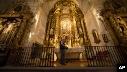 Two operators scan the altar with a Ground Penetration Radar at the Convent of the Barefoot Trinitarians in the historic Barrio de las Letras, or Literary Quarter in Madrid, Spain, April 28, 2014.