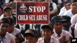 FILE - Indian schoolchildren participate in an awareness campaign rally to mark World Day for the Prevention of Child Abuse and Violence against Children, in Hyderabad, India.