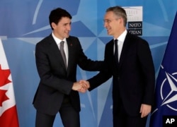 Canadian Prime Minister Justin Trudeau, left, shakes hands with NATO Secretary General Jens Stoltenberg at NATO headquarters in Brussels, Belgium, May 25, 2017.