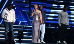 Nathan Morris, from left, Wanya Morris, Shawn Stockman, of Boyz II Men‎, and Alicia Keys, second left, sing a tribute in honor of the late Kobe Bryant at the 62nd annual Grammy Awards on Sunday, Jan. 26, 2020, in Los Angeles. (Photo by Matt Sayles/Invision.AP)