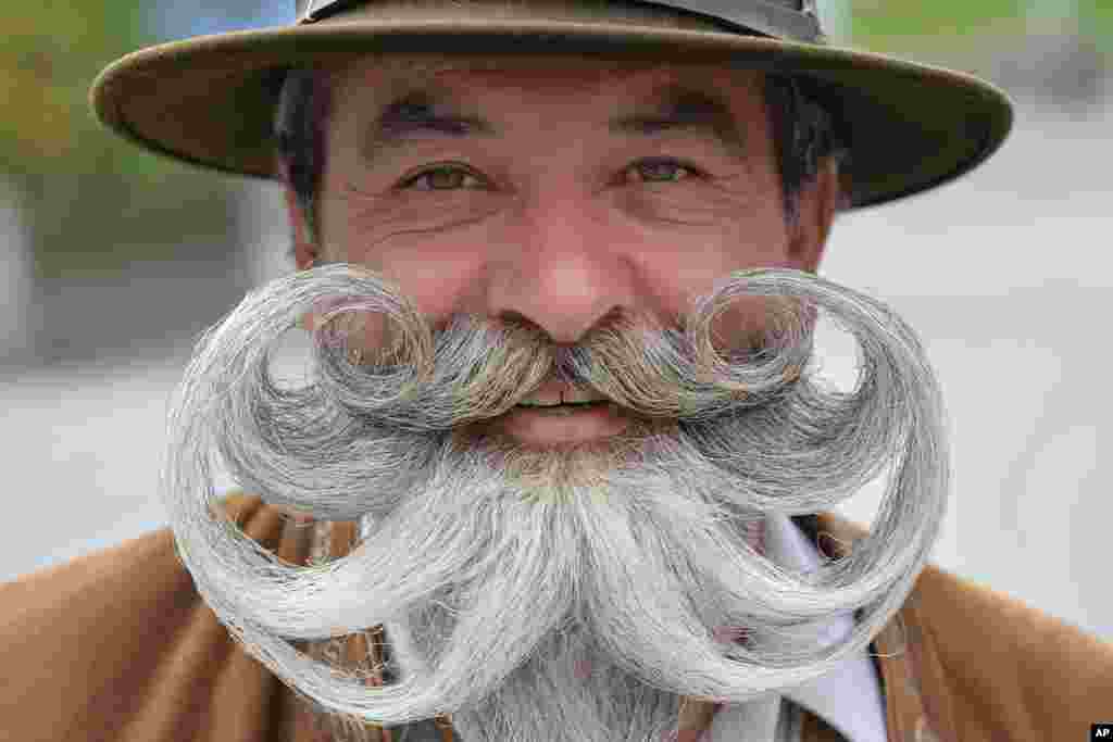 A participant poses for photographers during the "World Beard Championship" in Leogang, in the Austrian province of Salzburg.