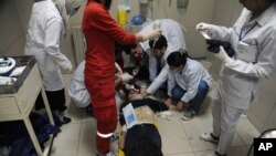 In this photo released by the Syrian official news agency SANA, shows a man receiving treatment at a hospital in Damascus, Syria, April. 7, 2018.