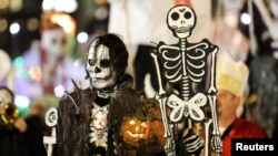 FILE: People in costume take part in the 45th Village Halloween Parade in Manhattan, New York, U.S., October 31, 2018. (REUTERS/Jeenah Moon)