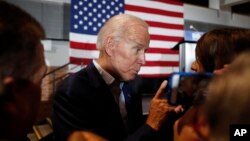 FILE - Former Vice President and Democratic presidential candidate Joe Biden greets audience members during a rally in Cedar Rapids, Iowa, April 30, 2019.