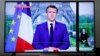 Fransa Cumhurbaşkanı Emmanuel Macron ekranda ulusal seslenirken