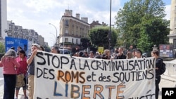 People hold a banner in front of the city hall of Montreuil, east of Paris. France announced a crackdown on the minorities two weeks ago, Interior Minister Brice Hortefeux said, (File August 14, 2010).