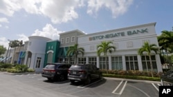 The Miami branch Stonegate Bank is shown, July 22, 2015, in Miami. Stonegate announced it is setting up a correspondent banking relationship with a Cuban financial institution. 