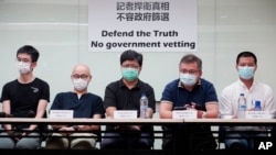 Representatives of Hong Kong media organizations attends a press conference in Hong Kong Thursday, Sept. 24, 2020. (AP Photo/Vincent Yu)