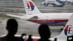 FILE - Malaysia Airlines' planes in Kuala Lumpur International Airport in Sepang, Malaysia in March 2016.